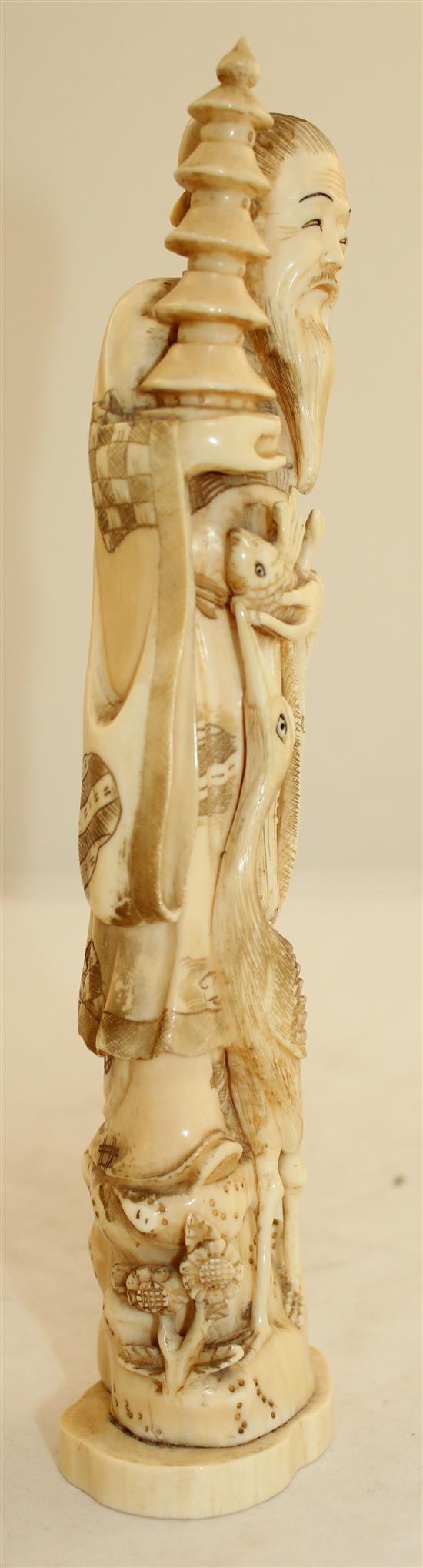 A Japanese walrus ivory figure of an immortal, early 20th century, 23.7cm